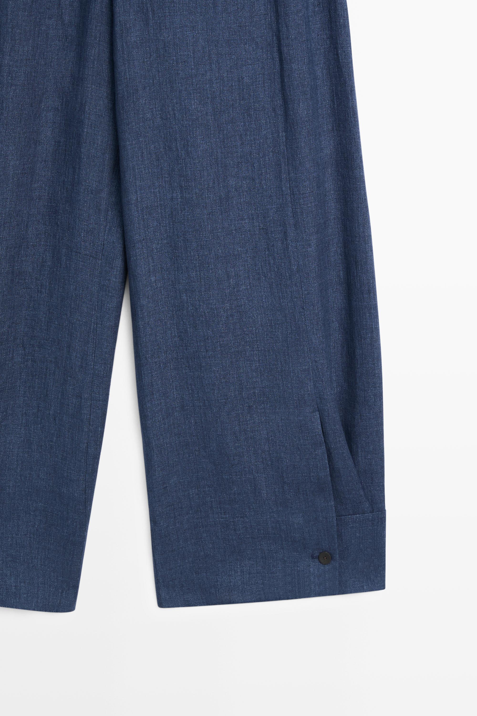 Total look linen pants with buttoned hems